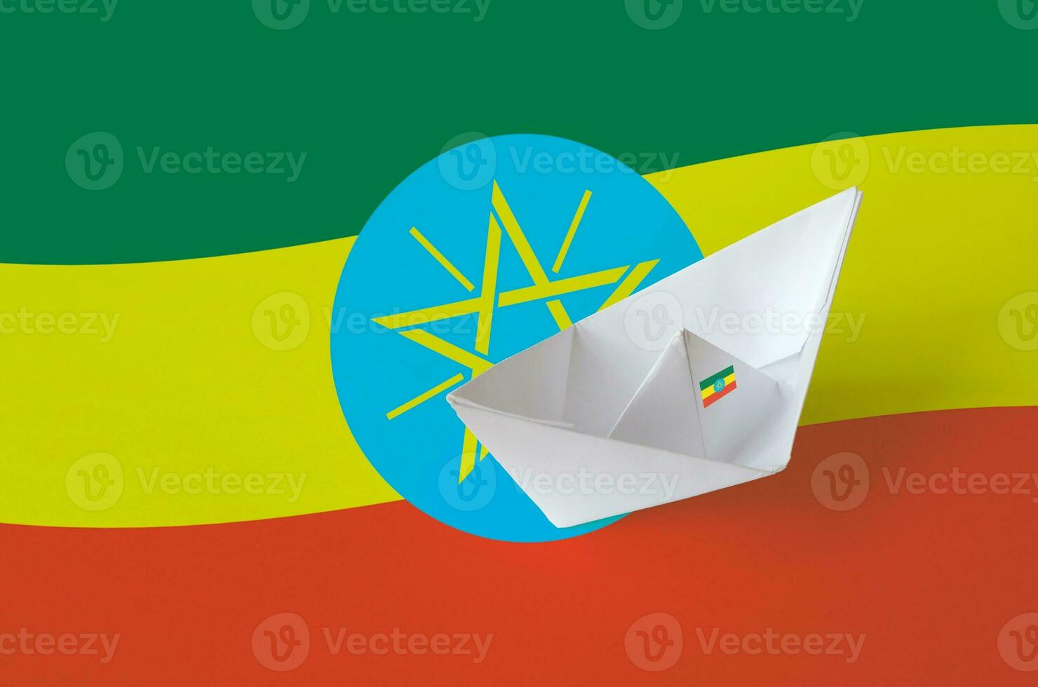 Ethiopia flag depicted on paper origami ship closeup. Handmade arts concept photo