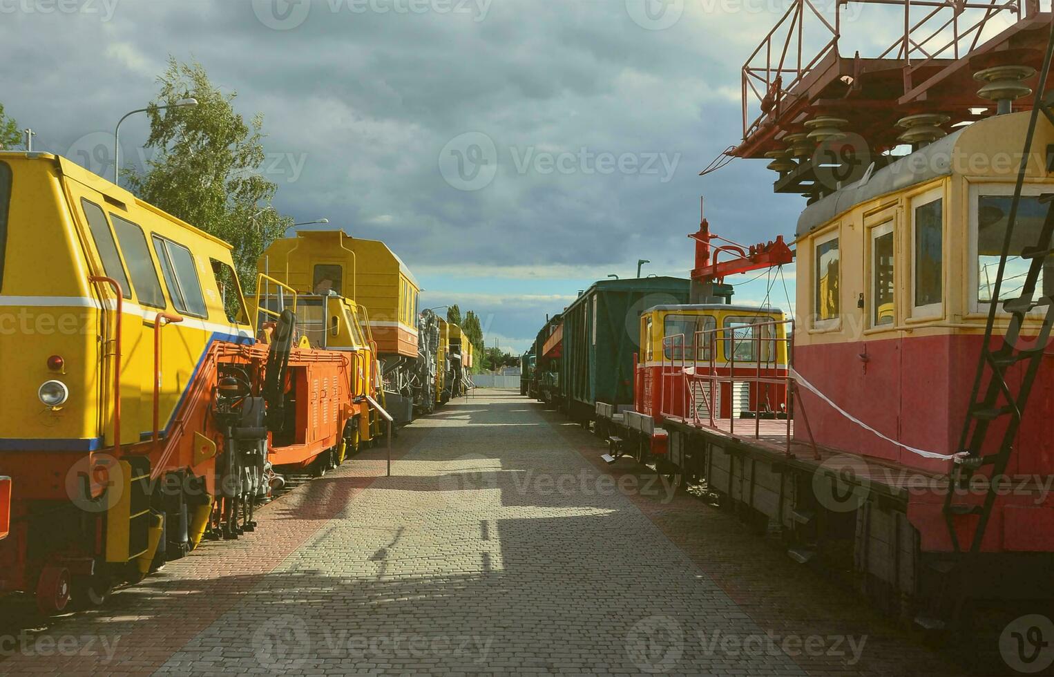 Cabs of modern Russian technical support electric trains and railway cranes. Side view of the heads of railway trains with a lot of wheels photo