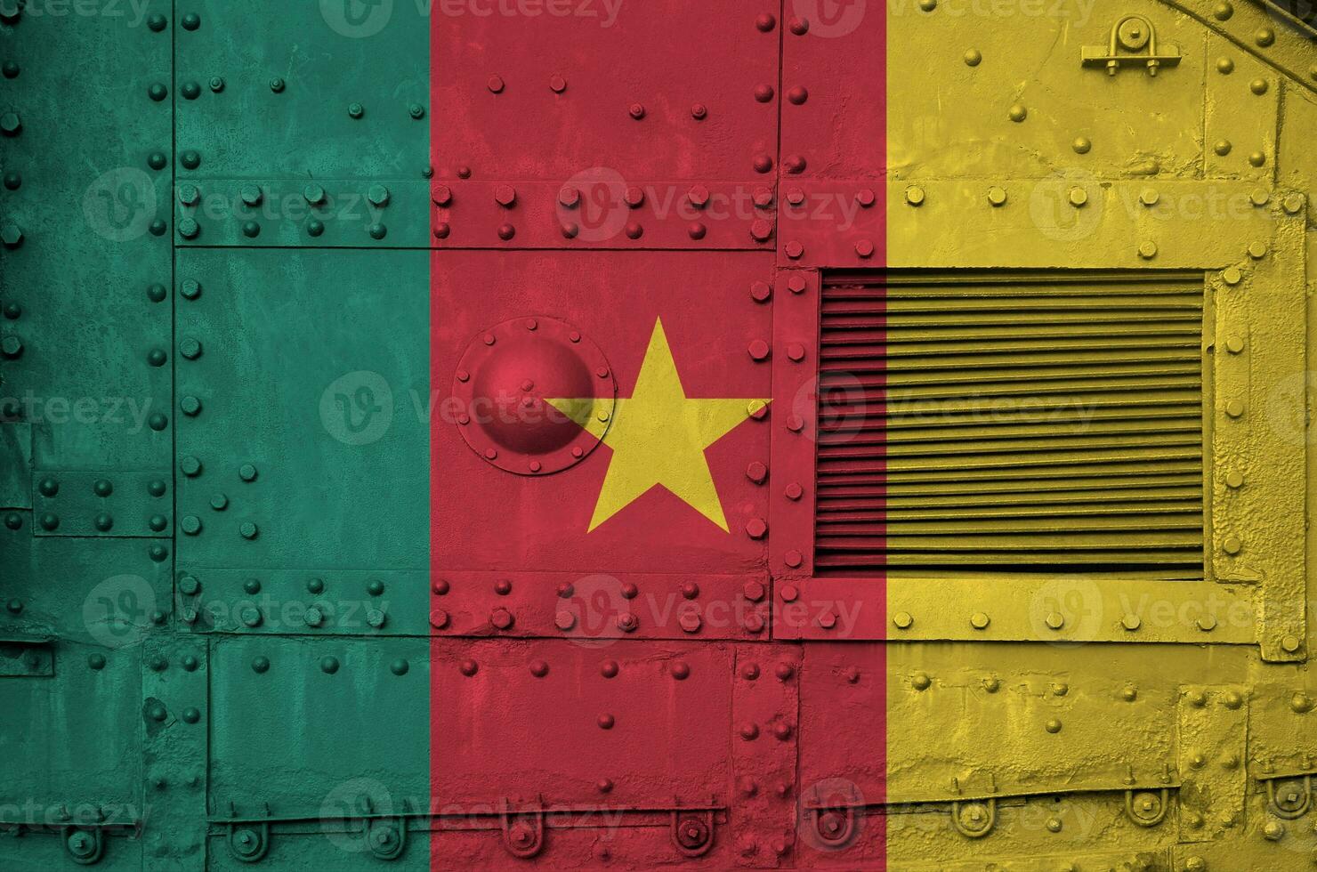 Cameroon flag depicted on side part of military armored tank closeup. Army forces conceptual background photo