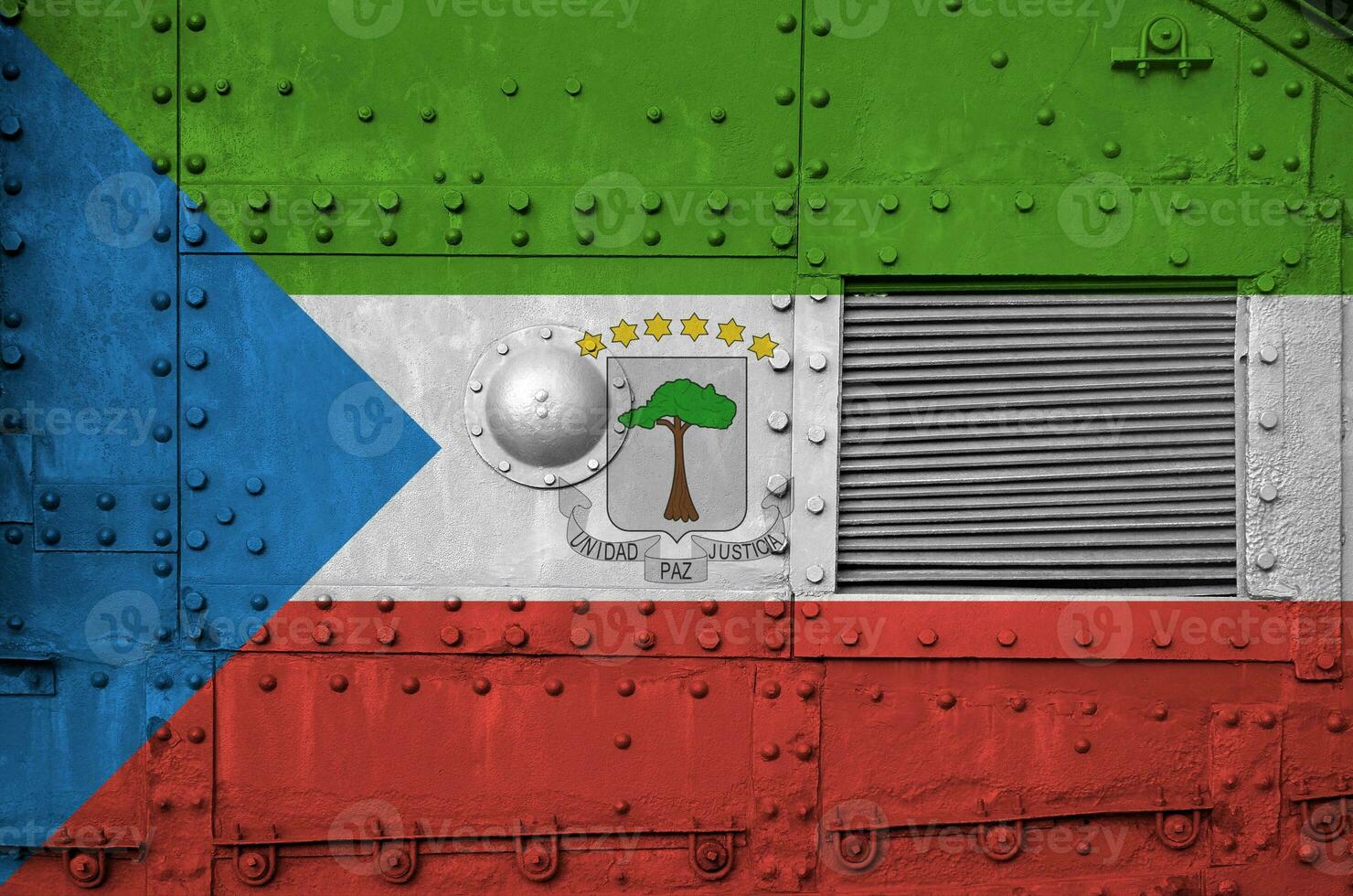 Equatorial Guinea flag depicted on side part of military armored tank closeup. Army forces conceptual background photo