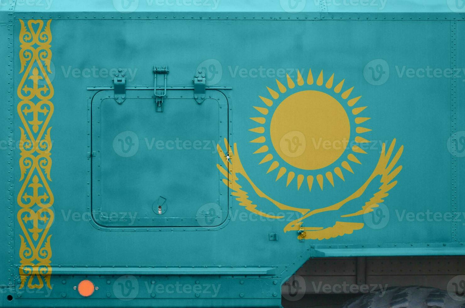 Kazakhstan flag depicted on side part of military armored truck closeup. Army forces conceptual background photo