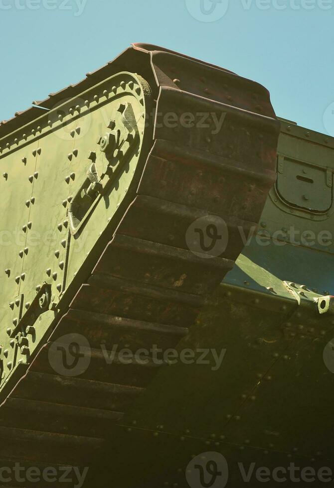 Caterpillars of the green British tank of the Russian Army Wrangel in Kharkov against the blue sky photo