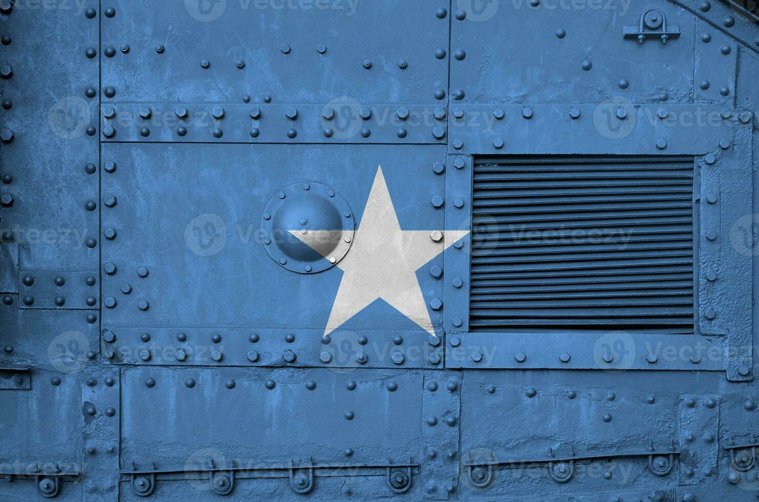 Somalia flag depicted on side part of military armored tank closeup. Army forces conceptual background photo