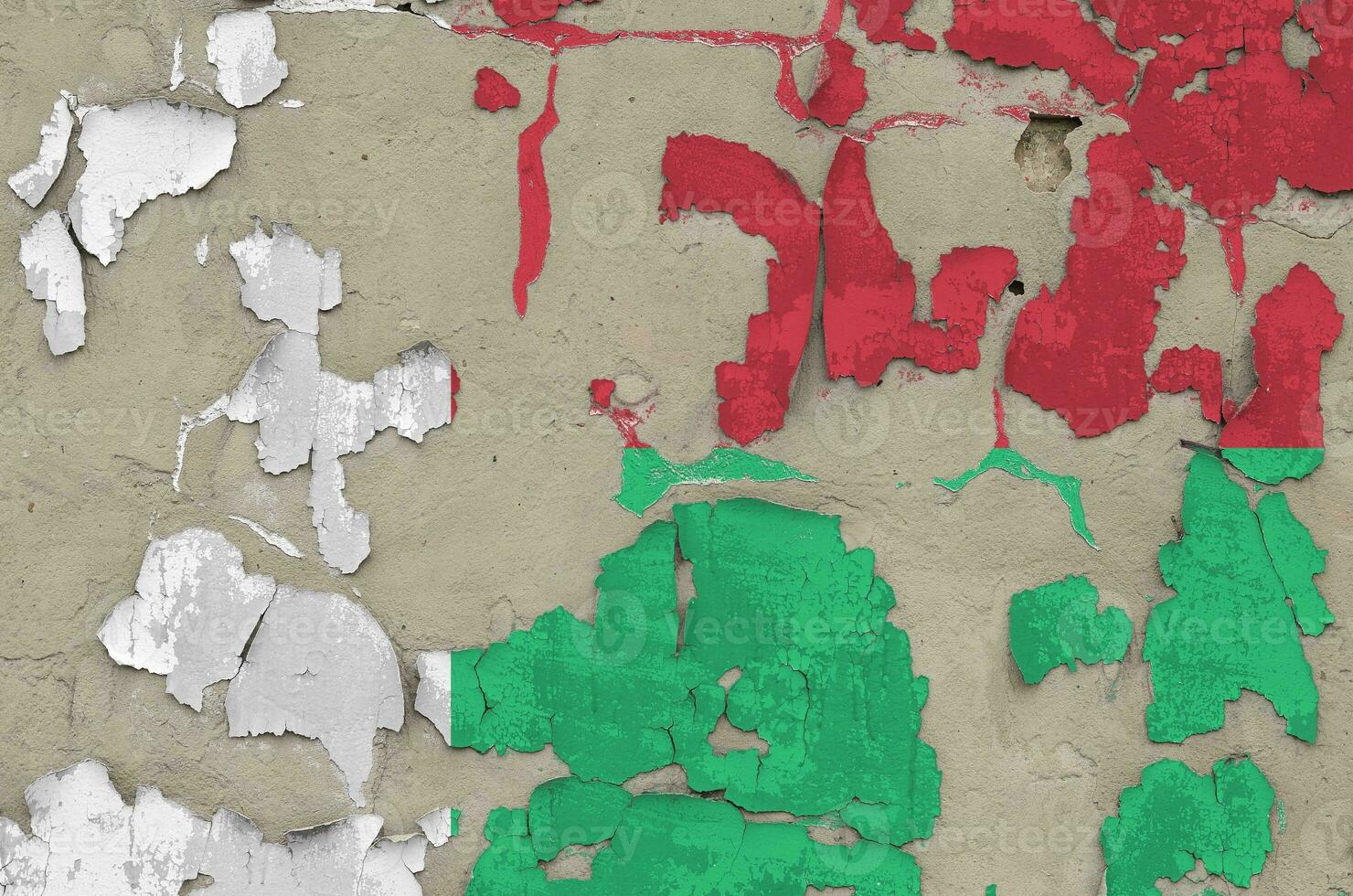 Madagascar flag depicted in paint colors on old obsolete messy concrete wall closeup. Textured banner on rough background photo