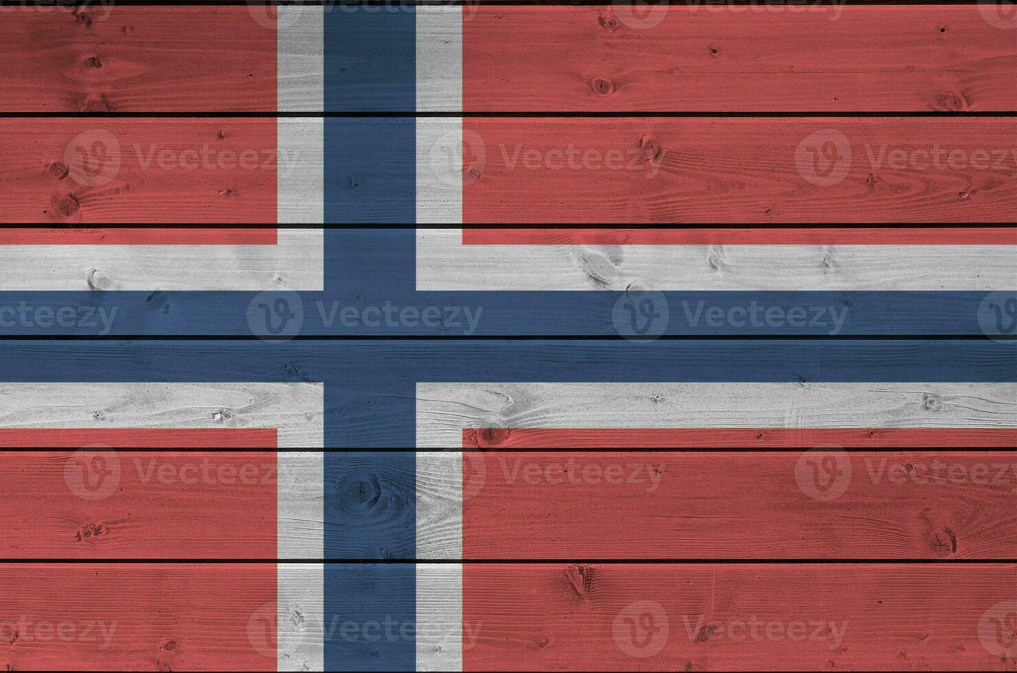 Norway flag depicted in bright paint colors on old wooden wall. Textured banner on rough background photo