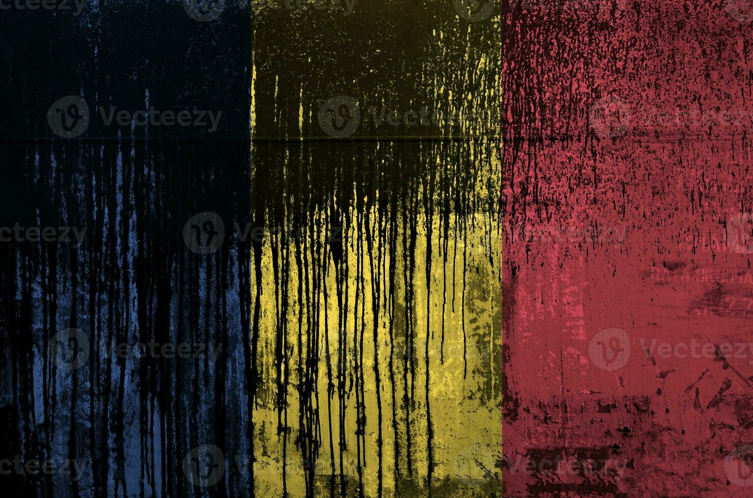 Romania flag depicted in paint colors on old and dirty oil barrel wall closeup. Textured banner on rough background photo