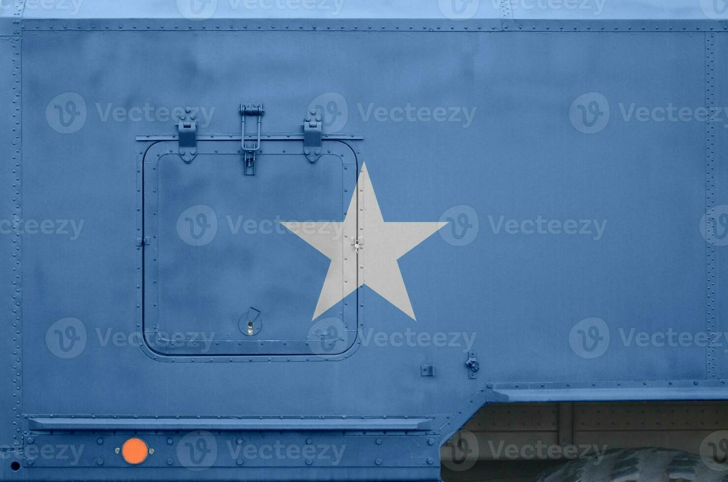 Somalia flag depicted on side part of military armored truck closeup. Army forces conceptual background photo