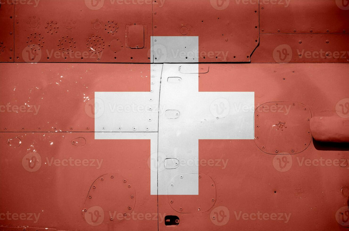 Switzerland flag depicted on side part of military armored helicopter closeup. Army forces aircraft conceptual background photo