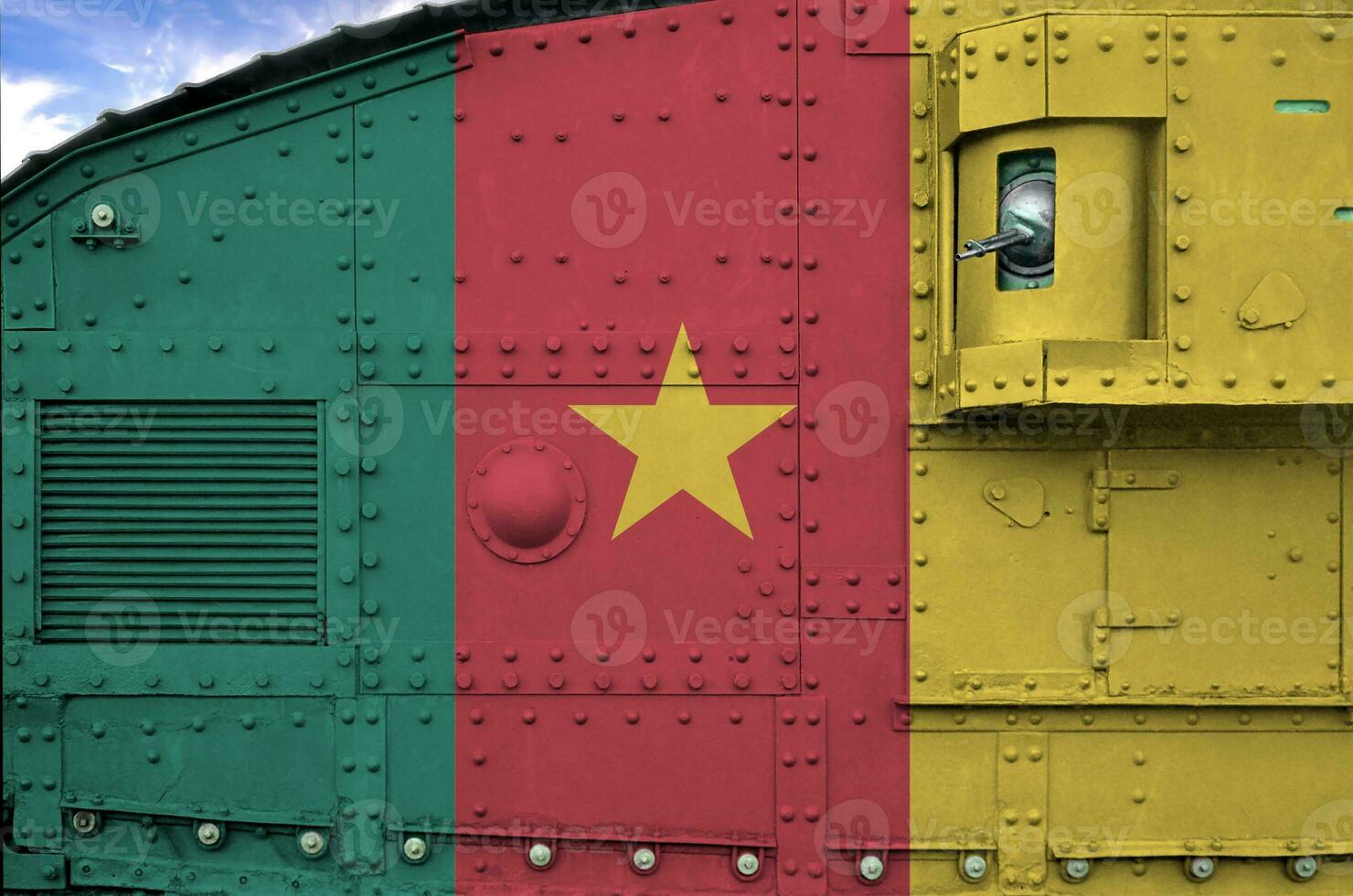 Cameroon flag depicted on side part of military armored tank closeup. Army forces conceptual background photo
