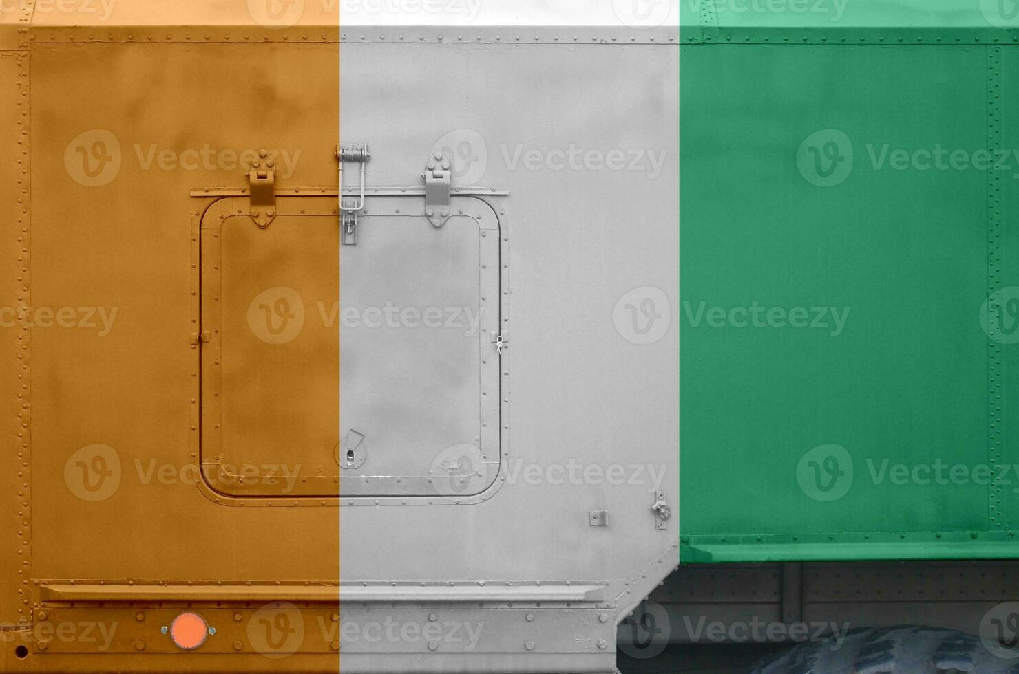 Ivory Coast flag depicted on side part of military armored truck closeup. Army forces conceptual background photo