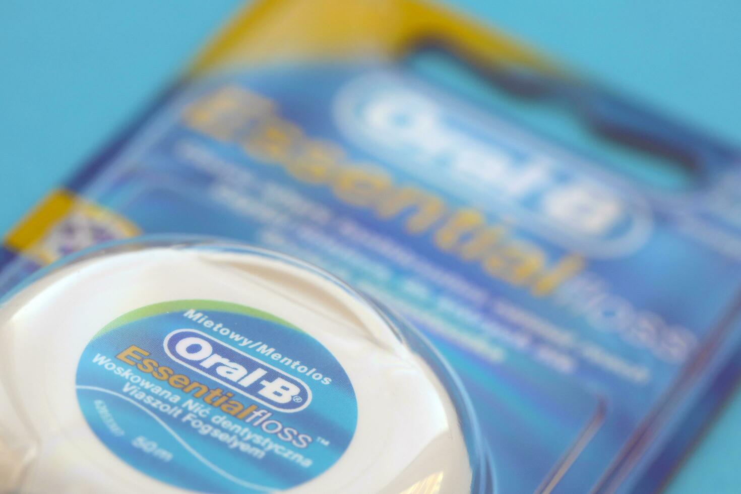 KYIV, UKRAINE - JULY 7, 2023 Oral-B Essentail Floss. Waxed dental floss in round case photo