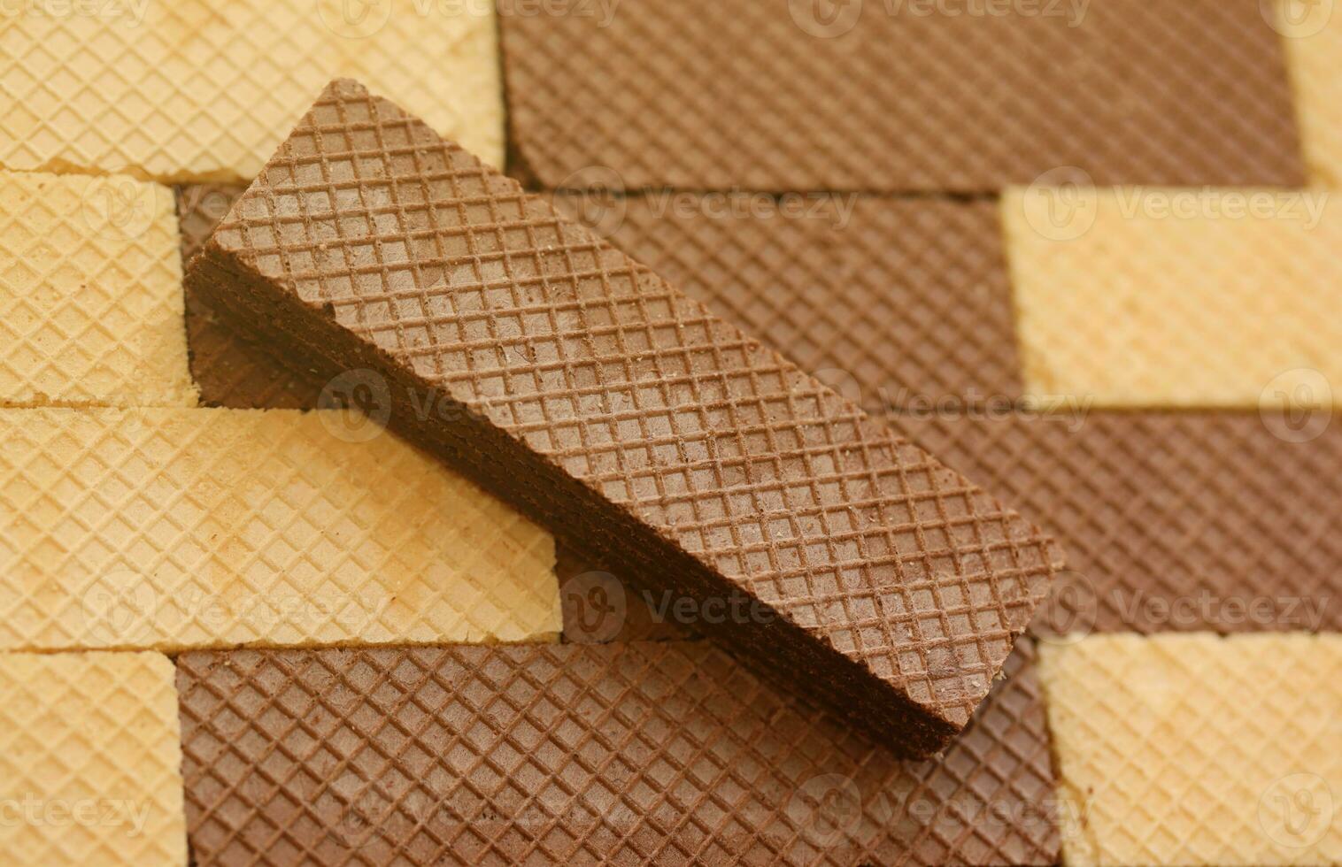 Stacked delicious chocolate wafers in large amount. Two different flavours of classic waffles photo