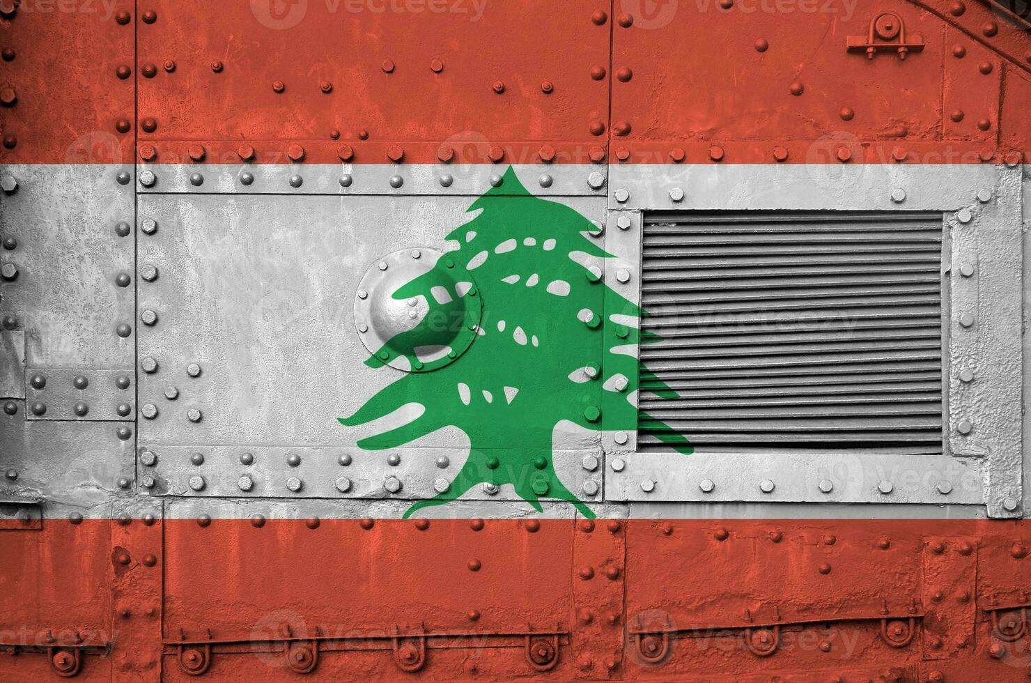 Lebanon flag depicted on side part of military armored tank closeup. Army forces conceptual background photo