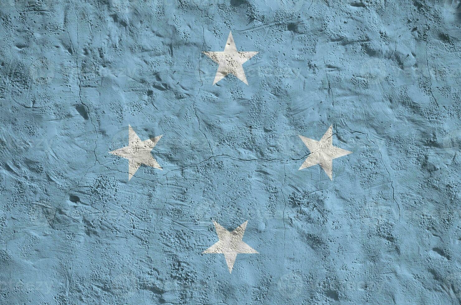 Micronesia flag depicted in bright paint colors on old relief plastering wall. Textured banner on rough background photo