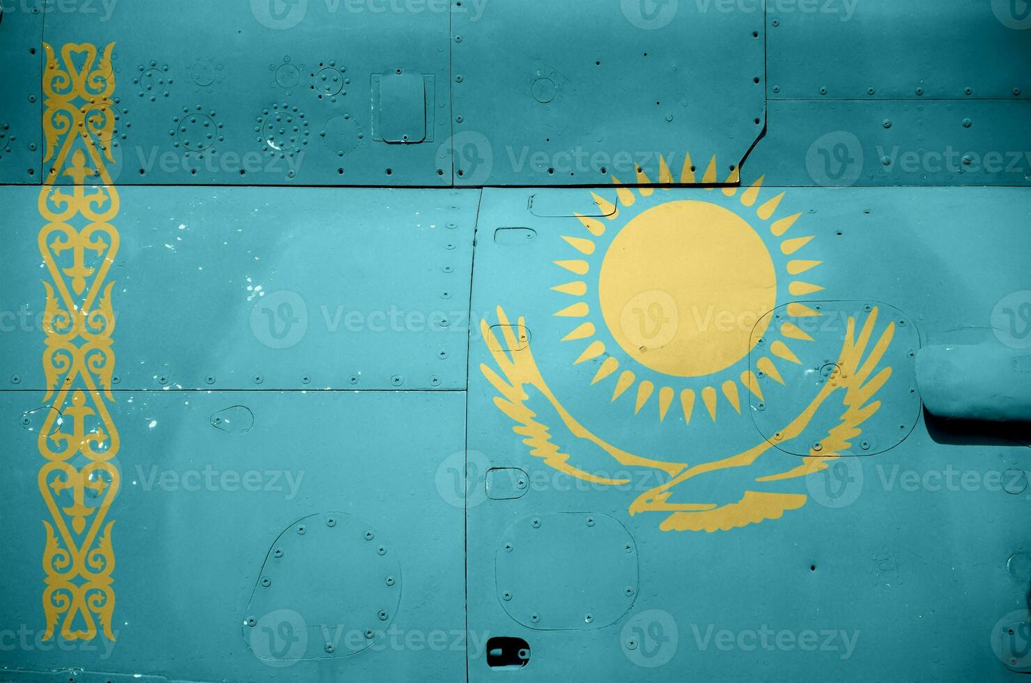 Kazakhstan flag depicted on side part of military armored helicopter closeup. Army forces aircraft conceptual background photo