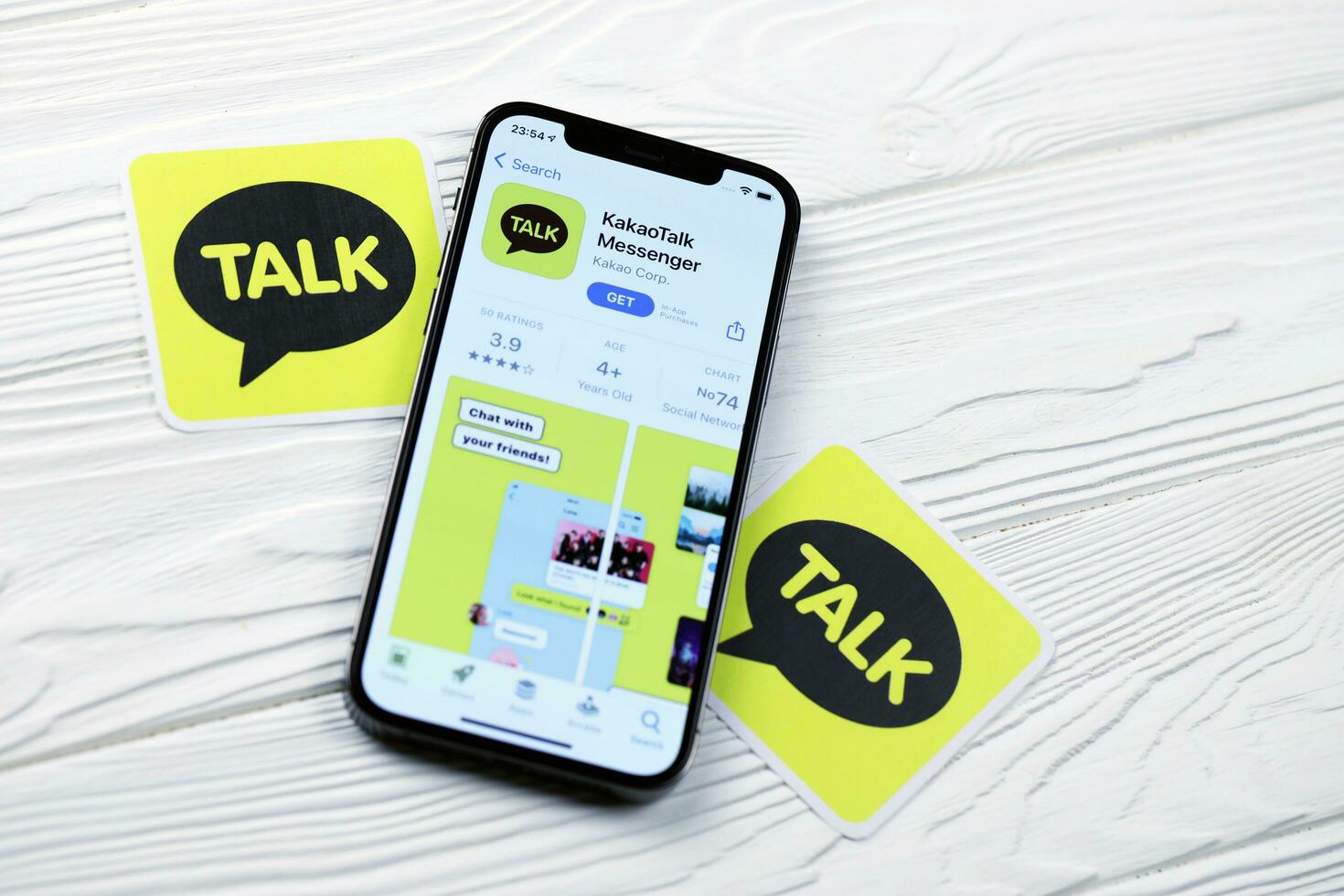 KHARKOV, UKRAINE - MARCH 5, 2021 KakaoTalk Messenger icon and application from App store on iPhone 12 pro display screen on white table photo