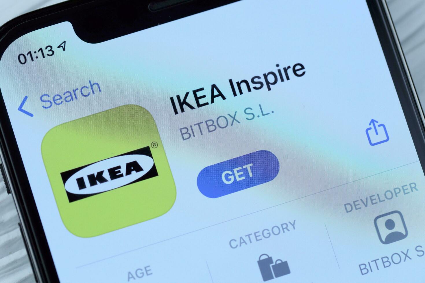 KHARKOV, UKRAINE - MARCH 5, 2021 Ikea icon and application from App store on iPhone 12 pro display screen on white table photo