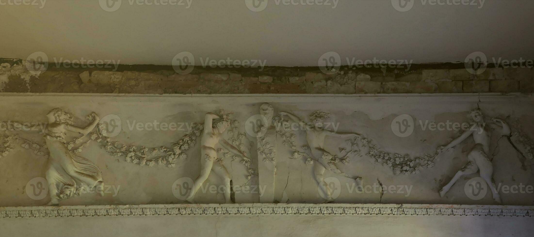 Old medieval elements of architectural decorations of buildings, moldings and patterns with relief shapes photo