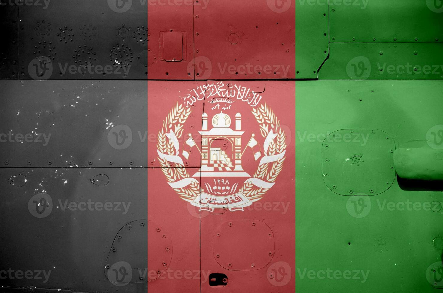 Afghanistan flag depicted on side part of military armored helicopter closeup. Army forces aircraft conceptual background photo