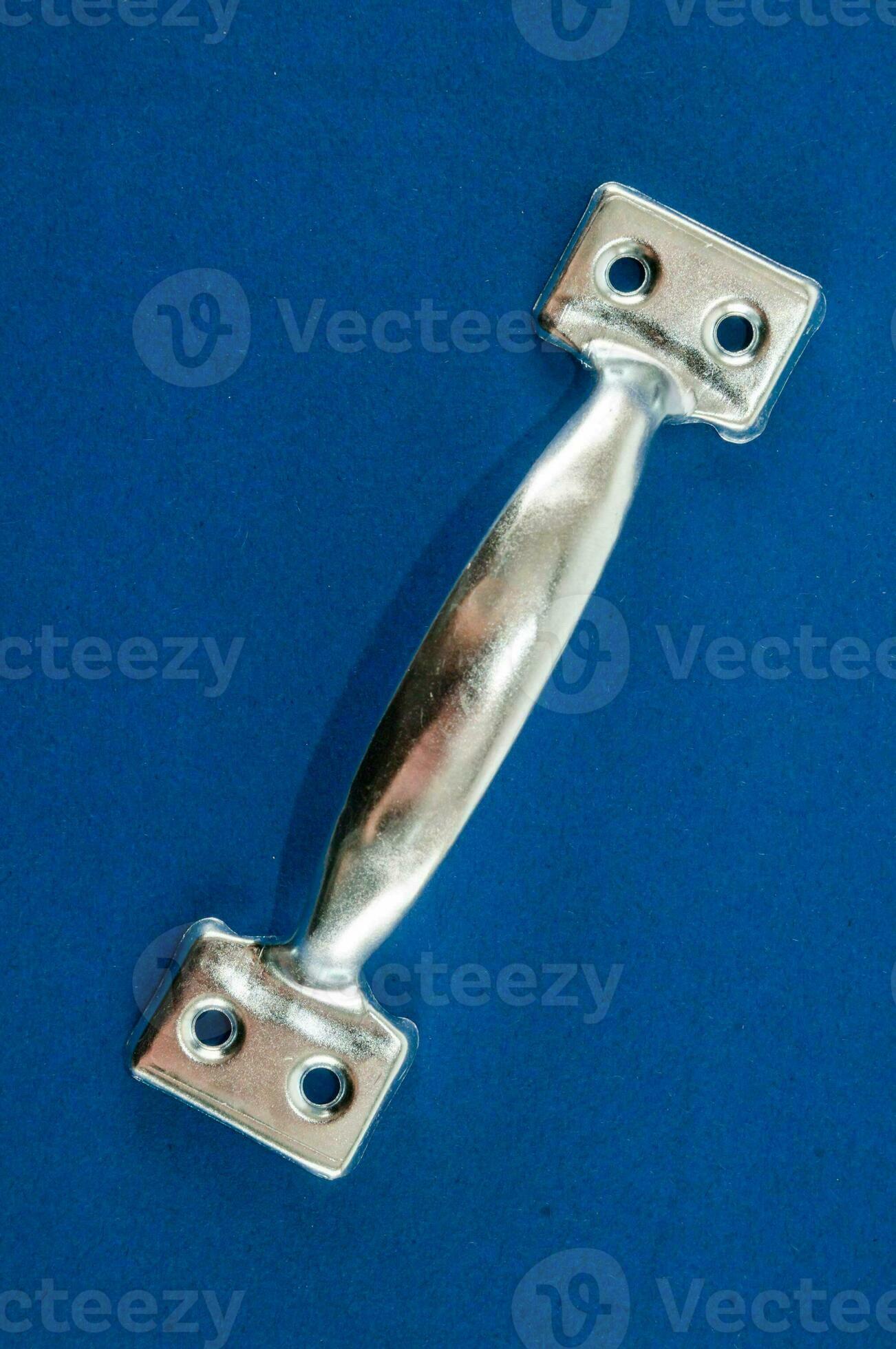a silver metal latch on a blue surface 33552154 Stock Photo at Vecteezy