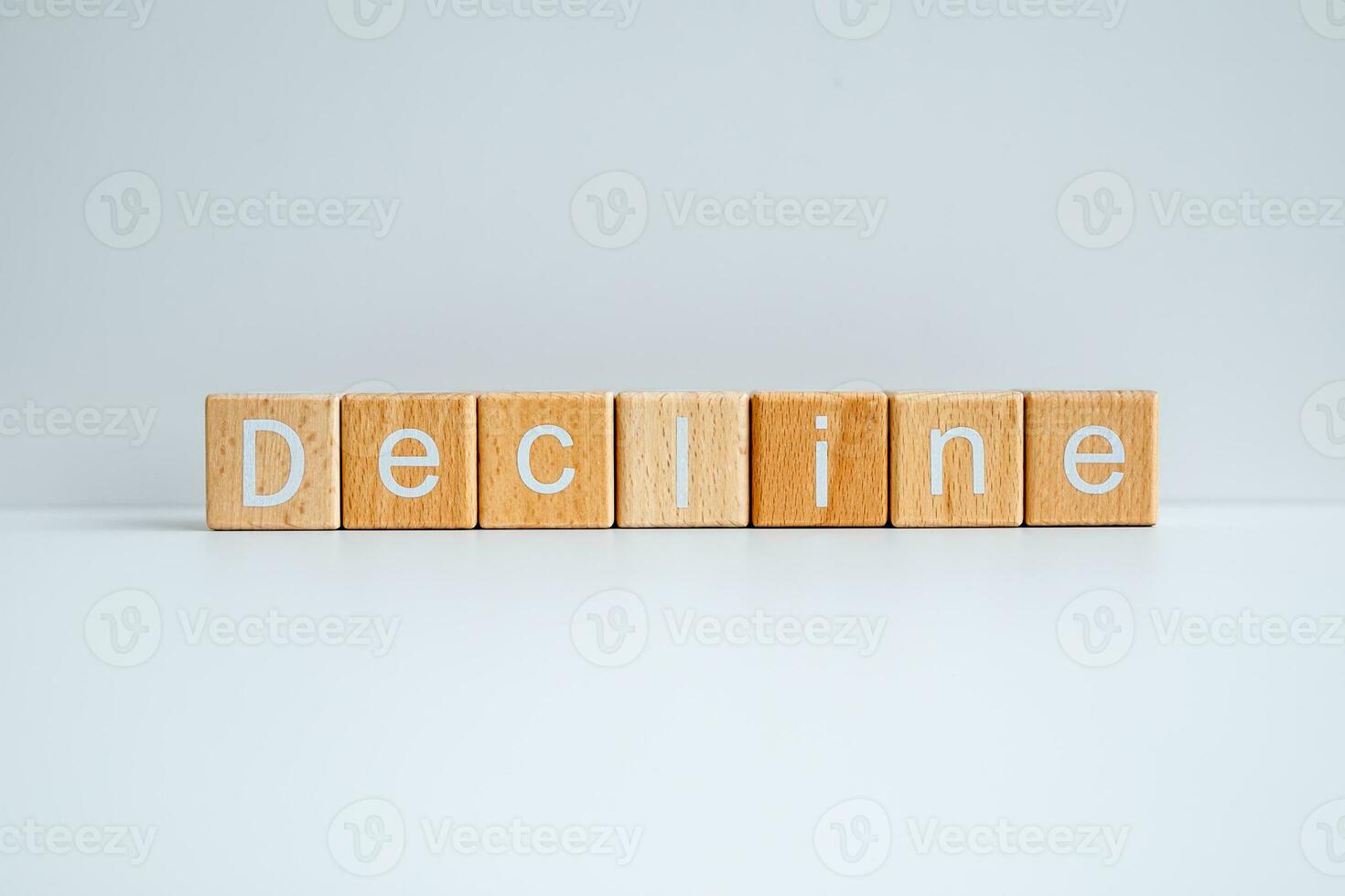 Wooden blocks form the text Decline against a white background. photo