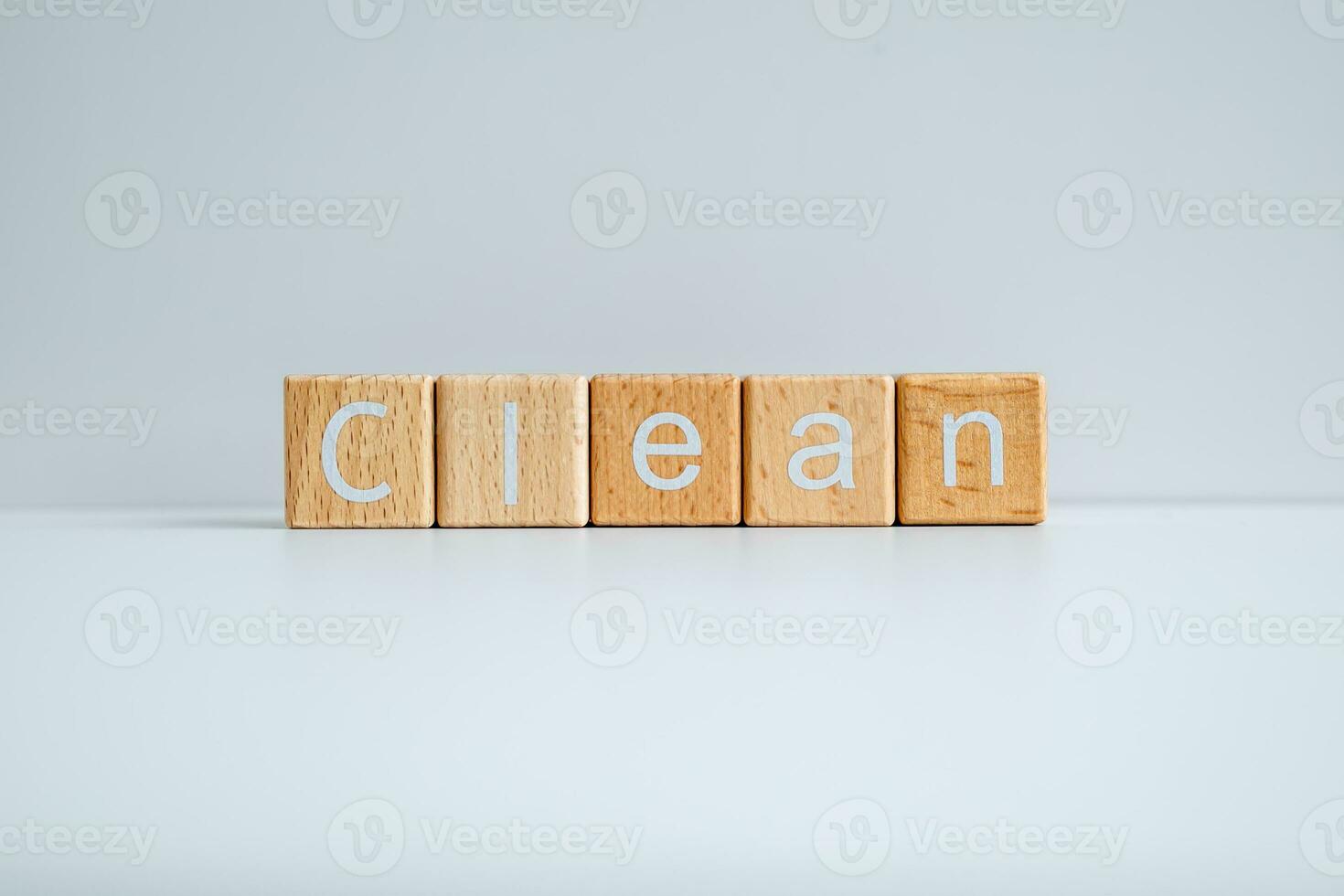 Wooden blocks form the text Clean against a white background. photo