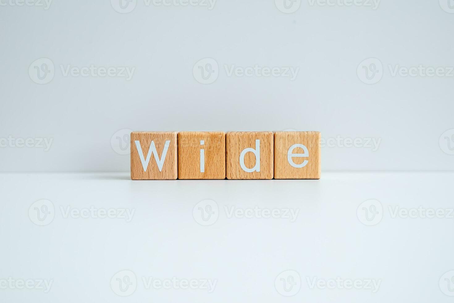 Wooden blocks form the text Wide against a white background. photo