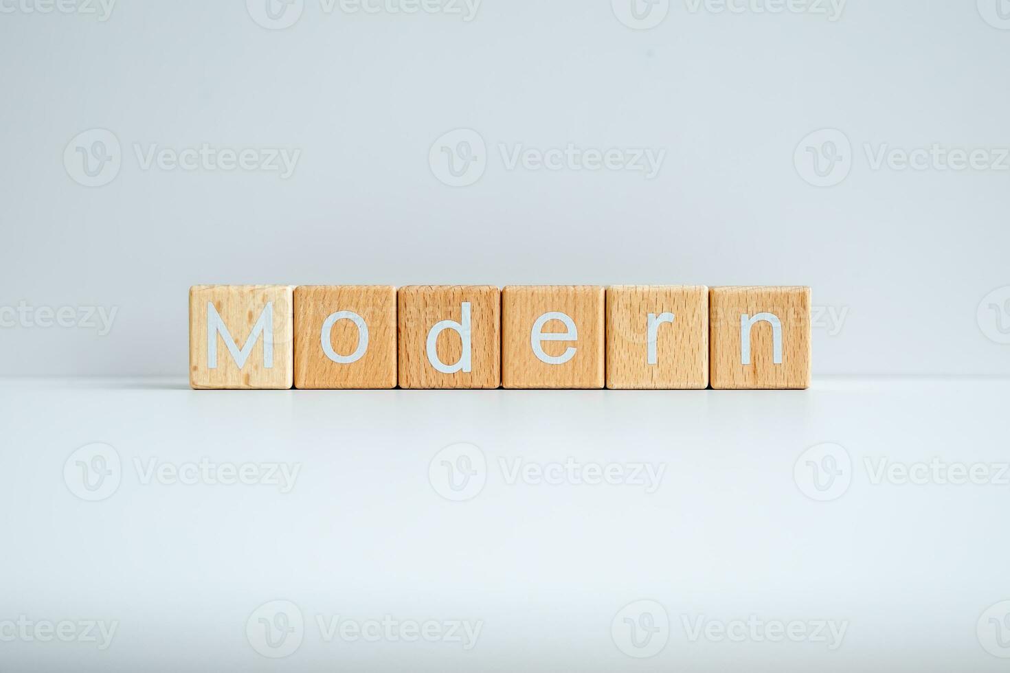 Wooden blocks form the text Modern against a white background. photo