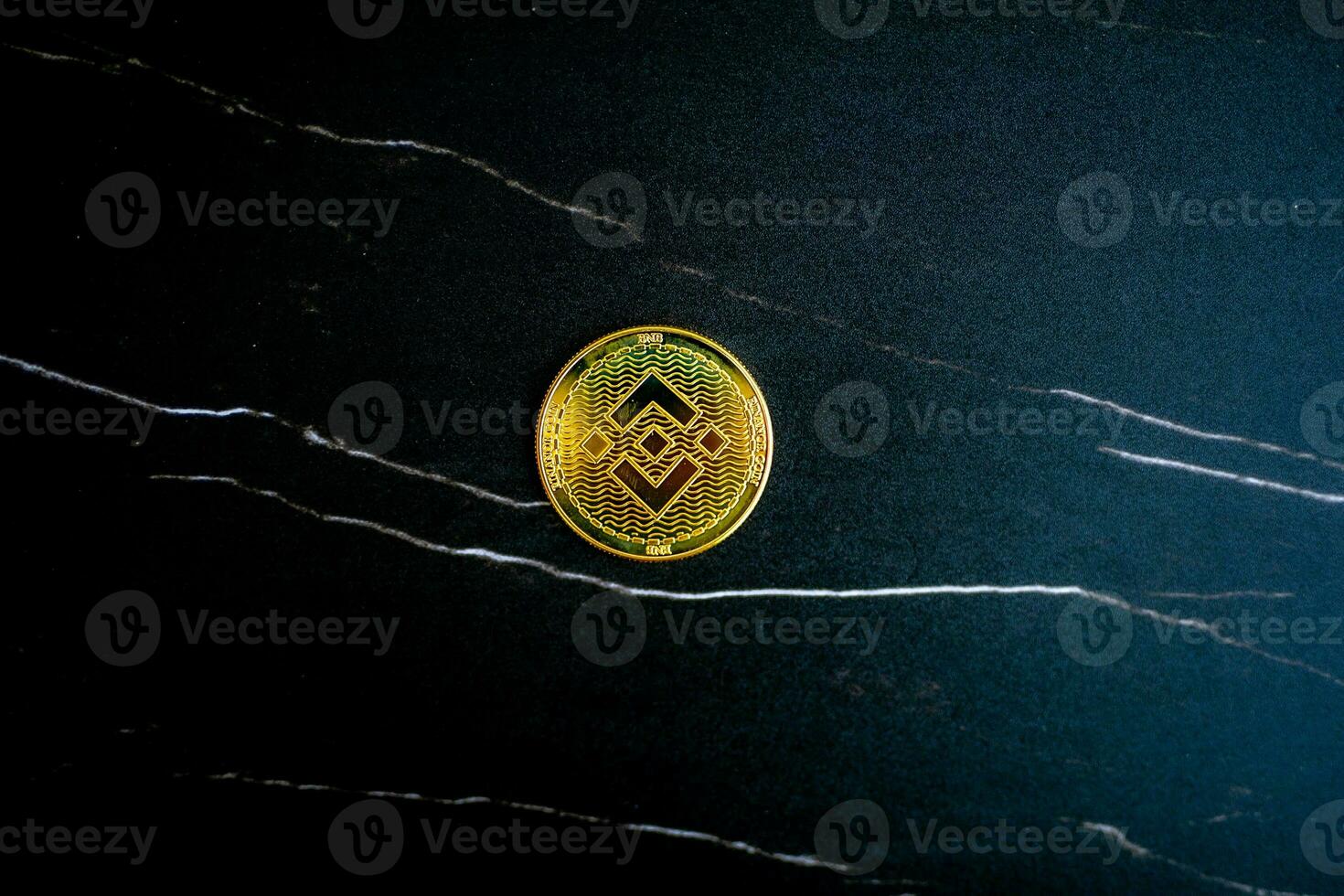 BNB coin on black marble texture. photo