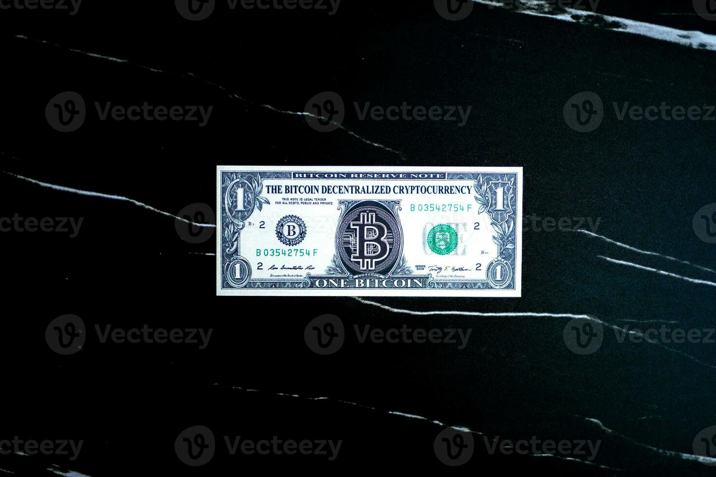 1 Bitcoin on black marble texture. photo