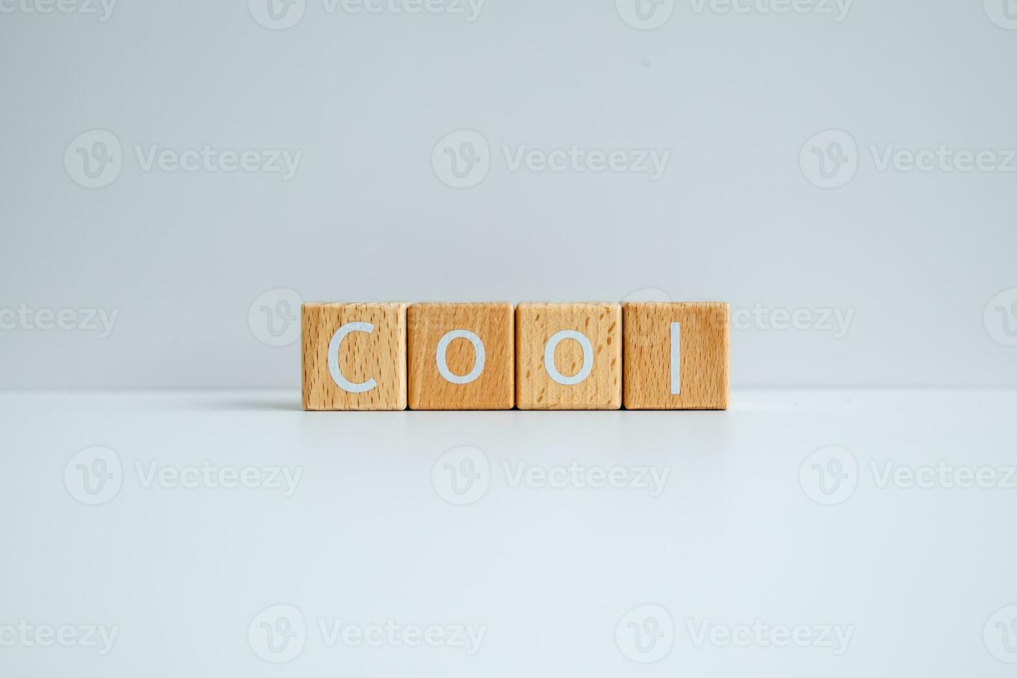 Wooden blocks form the text Cool against a white background. photo