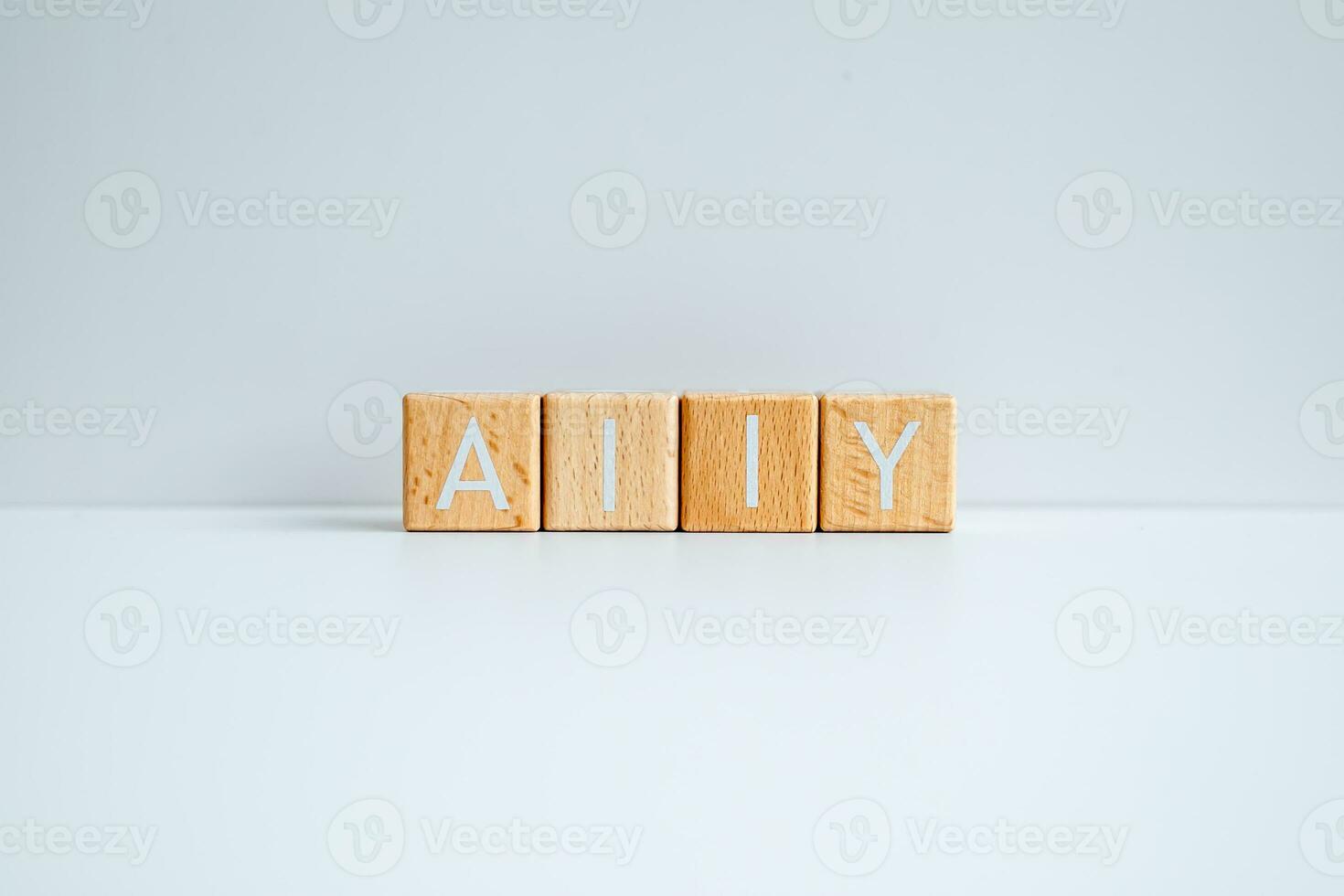 Wooden blocks form the text Ally against a white background. photo