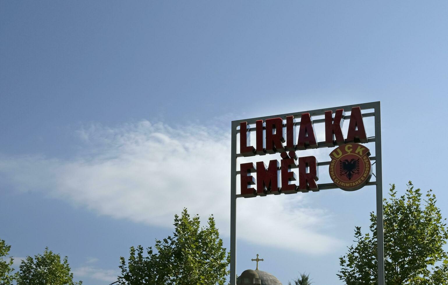 Pristina, Kosovo - September 20, 2023 - Sign with the words Freedom has a name - UCK in Albanian near the city center of Pristina. photo