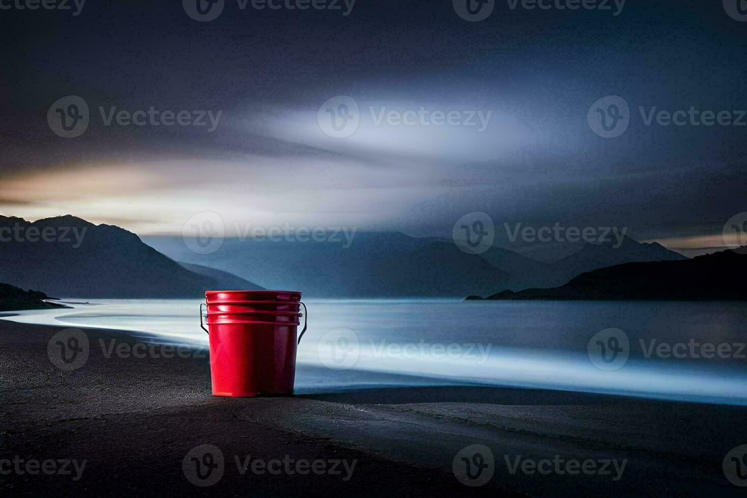 a red bucket sitting on the beach at night. AI-Generated photo