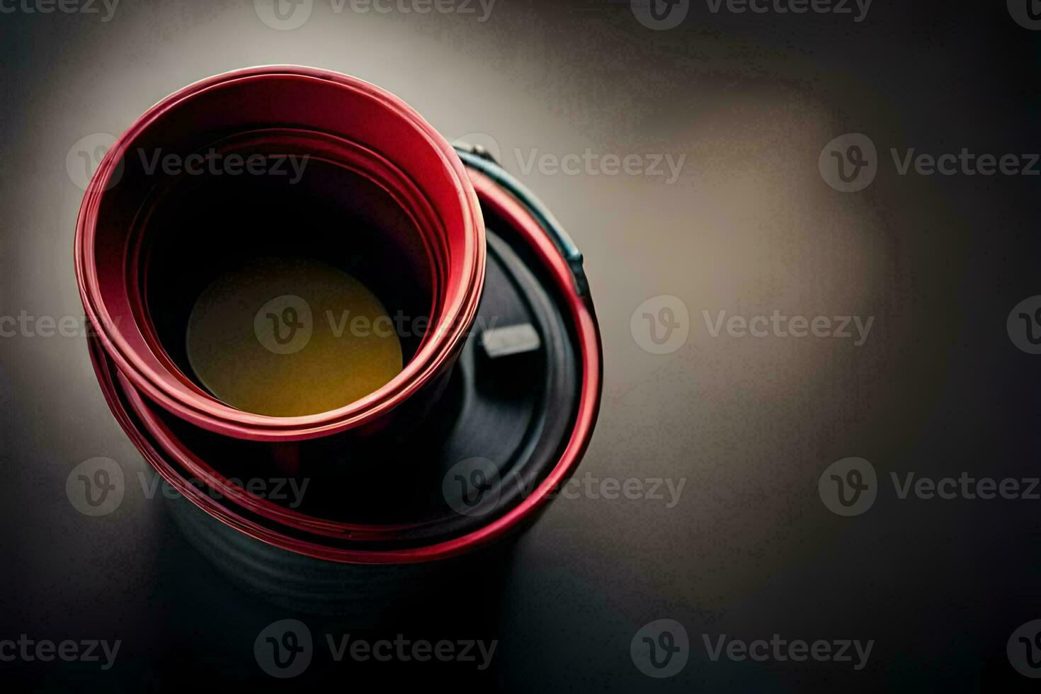 a red and black coffee cup on a table. AI-Generated photo
