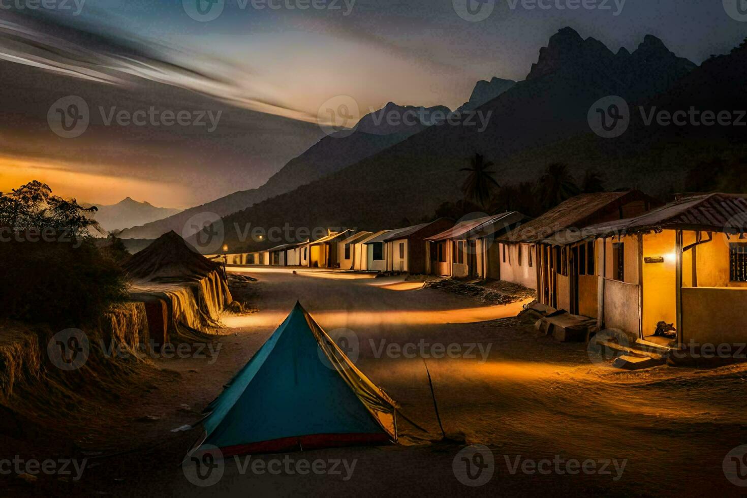 a tent is lit up at dusk in front of a mountain village. AI-Generated photo