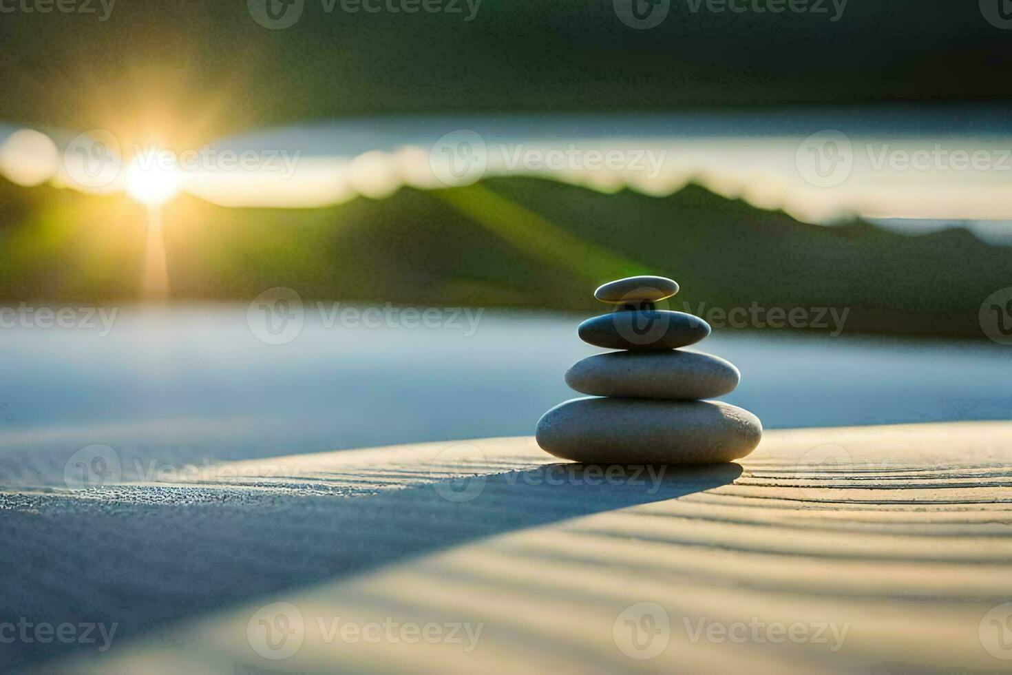 a stack of stones on the beach with the sun in the background. AI-Generated photo