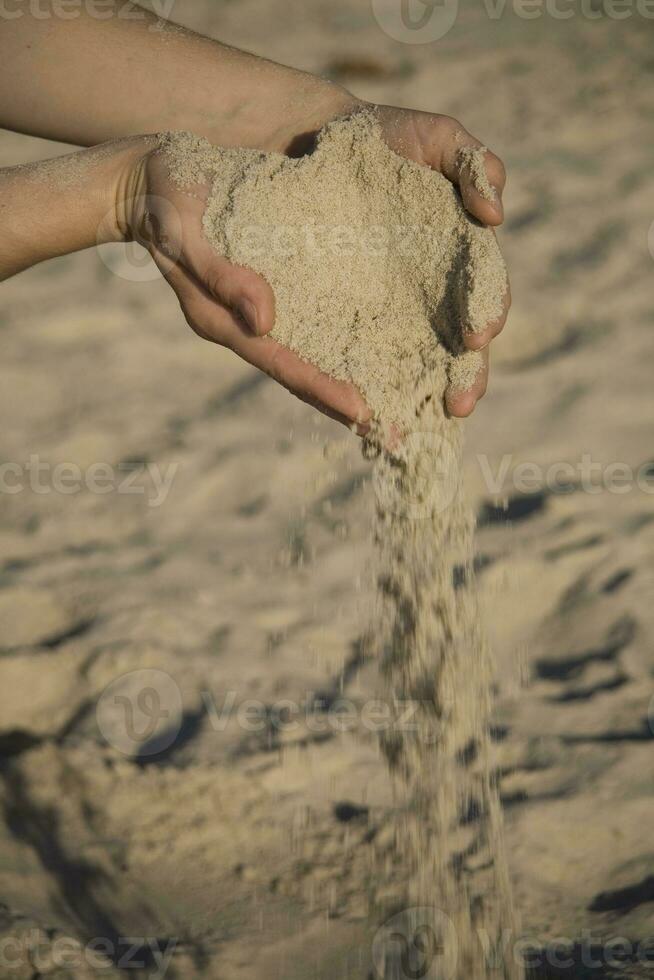 sand in hands photo