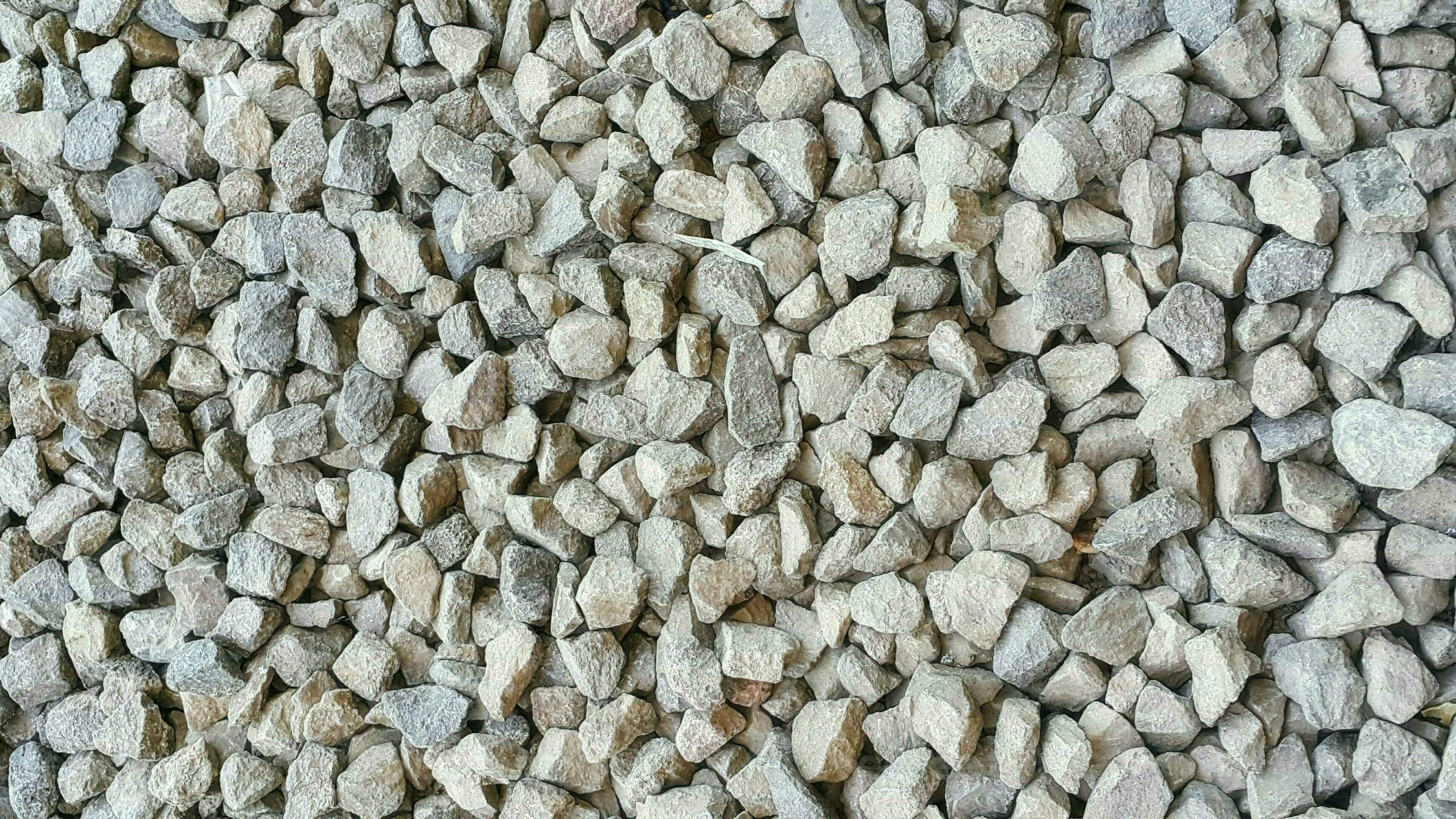 La Piedra Blanca Del Guijarro Cementó El Piso, Fondo De La Textura