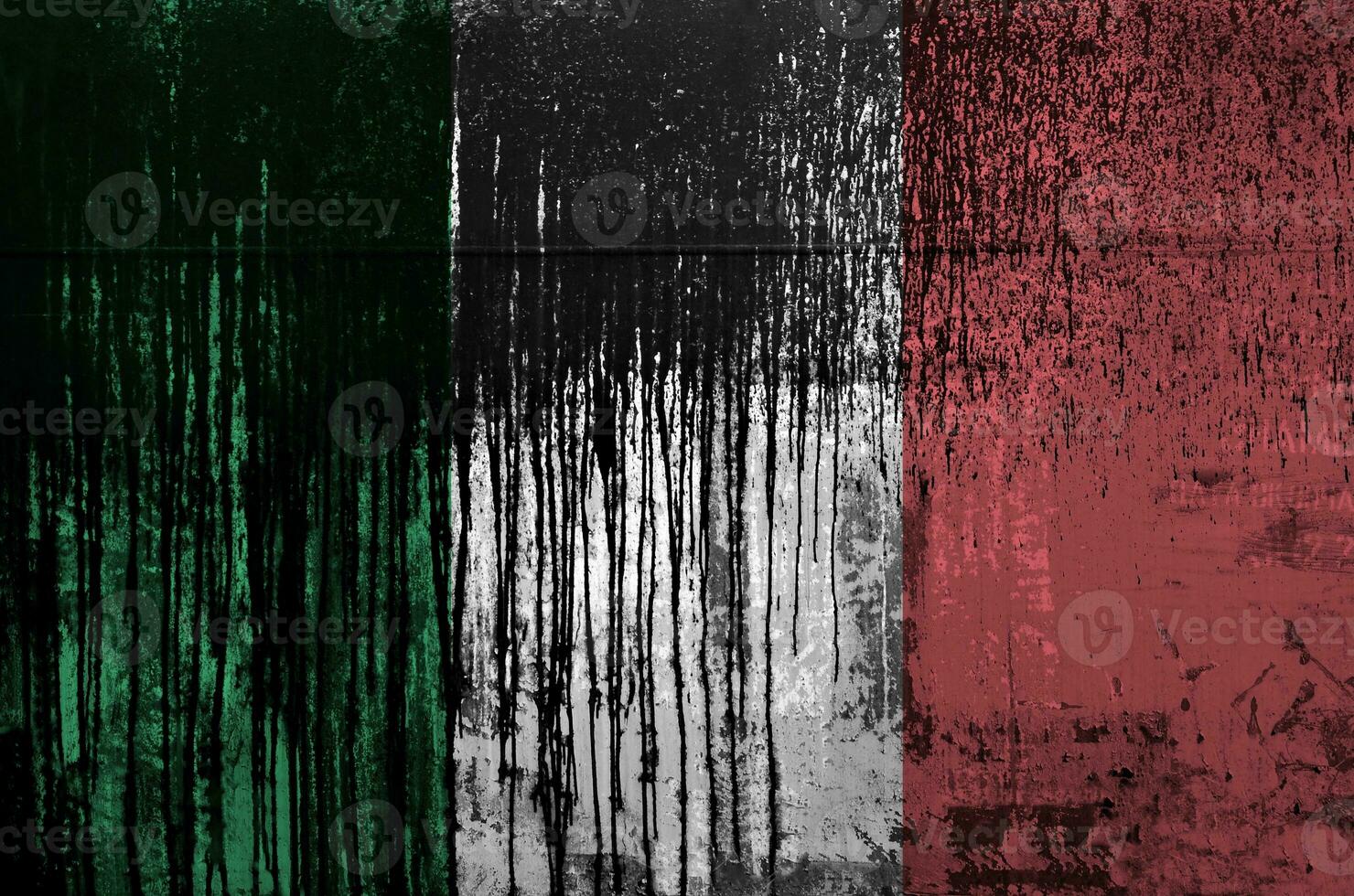 Italy flag depicted in paint colors on old and dirty oil barrel wall closeup. Textured banner on rough background photo