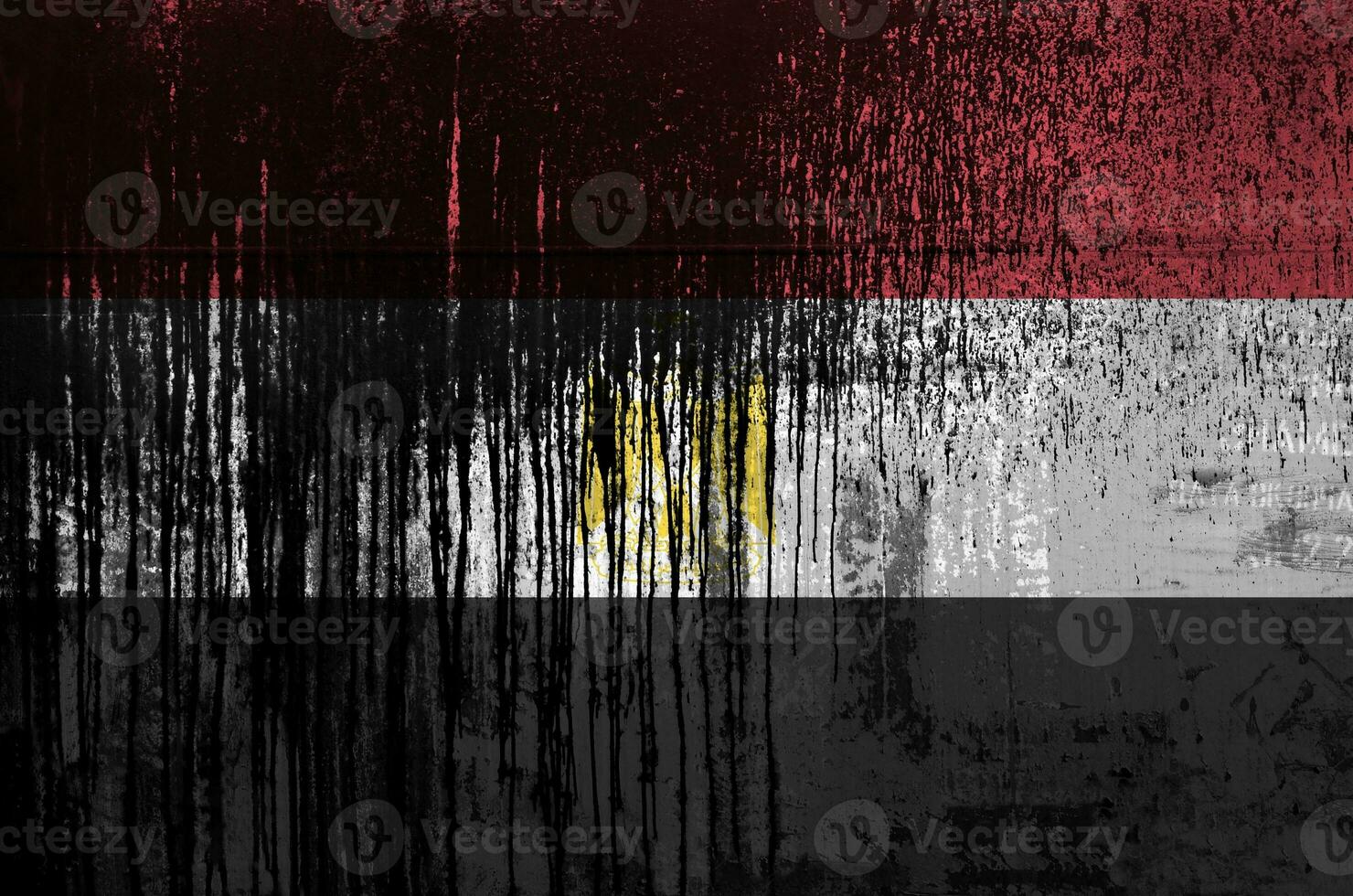 Egypt flag depicted in paint colors on old and dirty oil barrel wall closeup. Textured banner on rough background photo