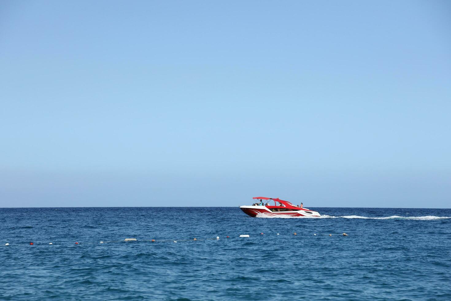 ANTALYA, TURKEY - MAY 15, 2021 Luxurious inflatable rib speed boat cruising in mediterranean deep sea photo