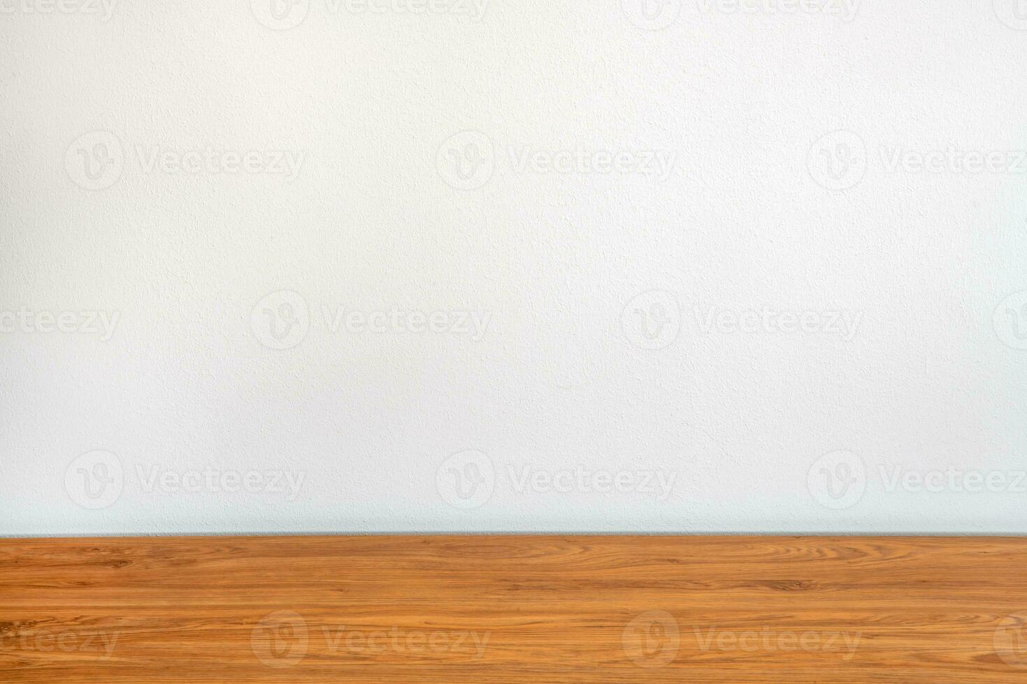 Empty wooden table and white wall background photo