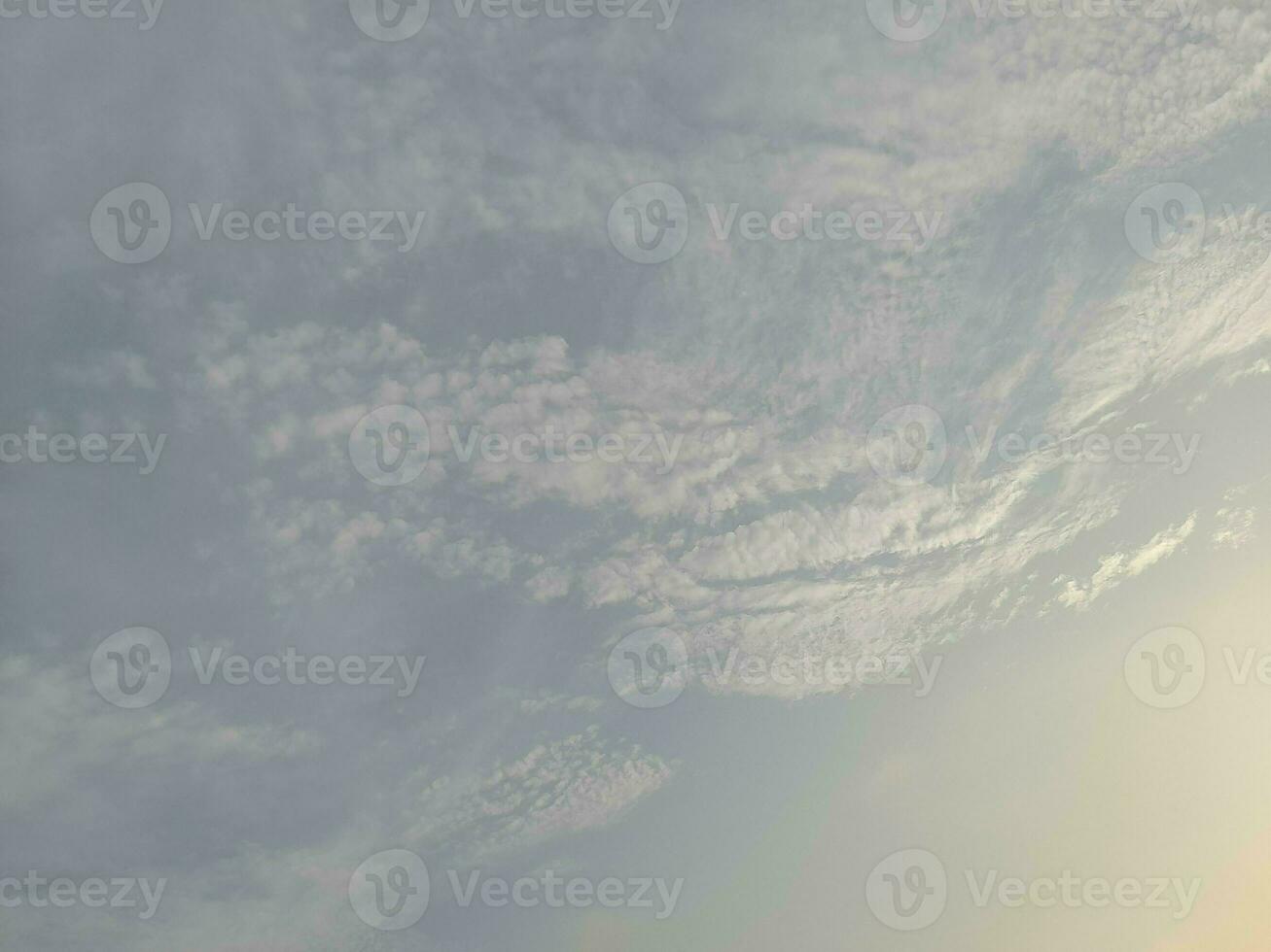 Nature background. Sky, sun and clouds with rays of light at sunset on the island of Lombok, Indonesia. photo