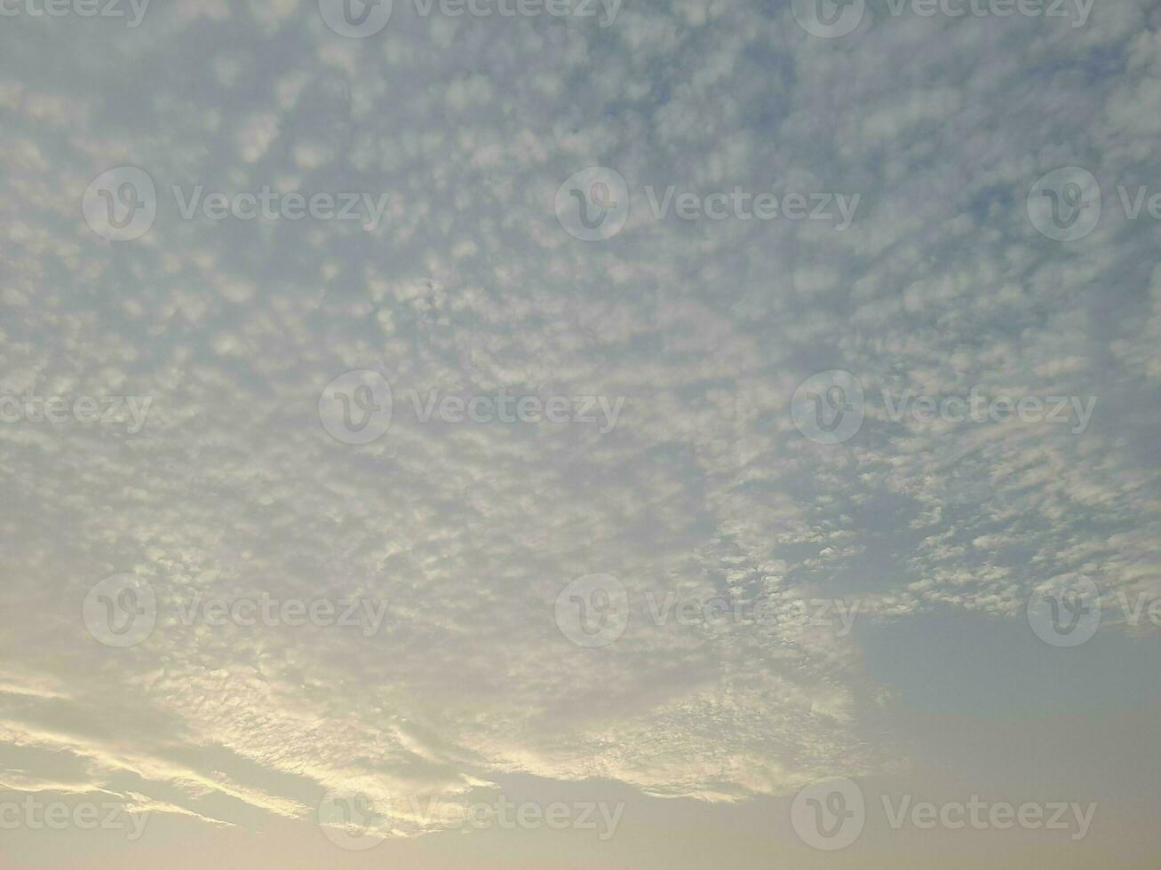 Nature background. Sky, sun and clouds with rays of light at sunset on the island of Lombok, Indonesia. photo