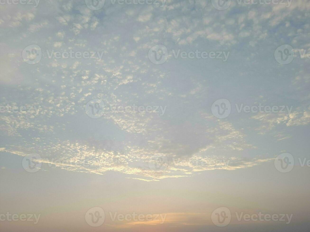 Nature background. Sky, sun and clouds with rays of light at sunset on the island of Lombok, Indonesia. photo