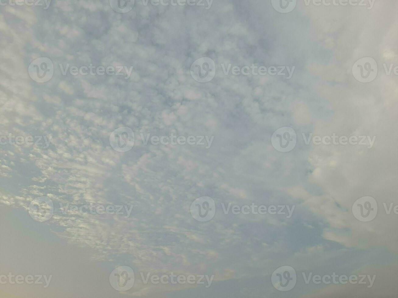 Nature background. Sky, sun and clouds with rays of light at sunset on the island of Lombok, Indonesia. photo