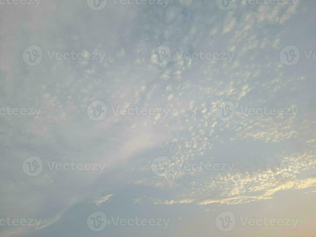 Nature background. Sky, sun and clouds with rays of light at sunset on the island of Lombok, Indonesia. photo