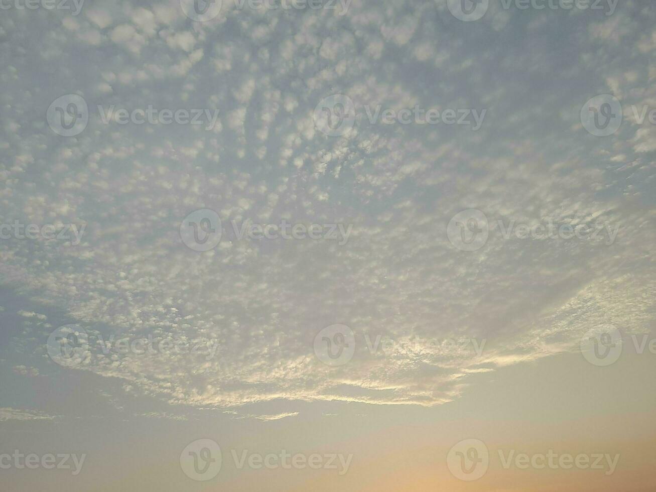 Nature background. Sky, sun and clouds with rays of light at sunset on the island of Lombok, Indonesia. photo