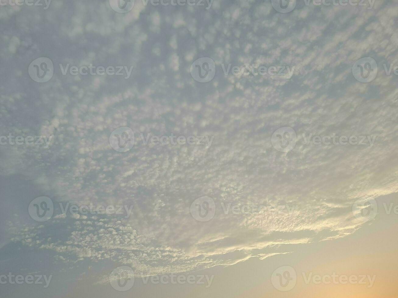 Nature background. Sky, sun and clouds with rays of light at sunset on the island of Lombok, Indonesia. photo